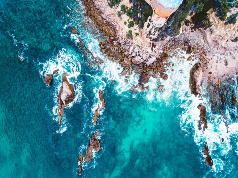 The waves hitting the rocks at Inspiration Point in Newport Beach 