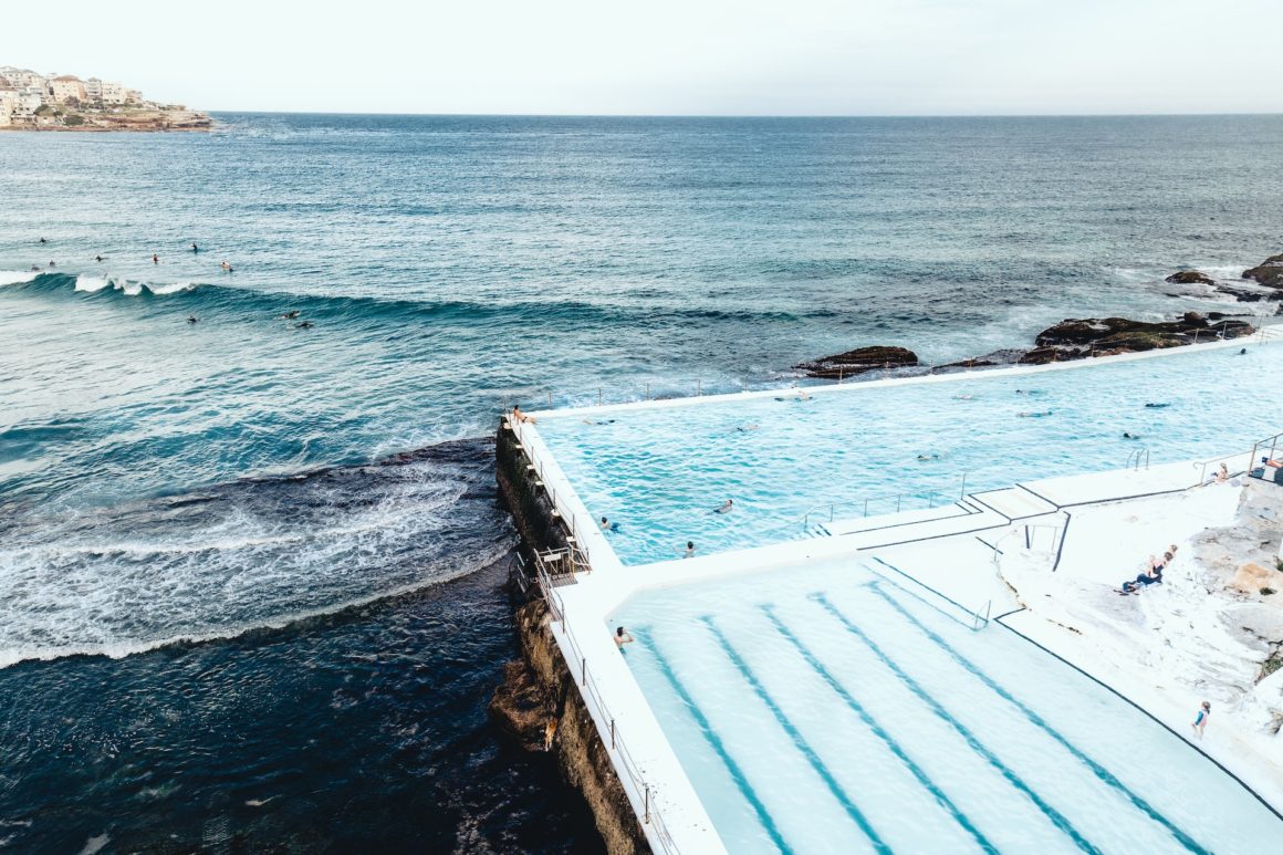 Bondi Beach, Sydney's best and most famous beach, swimming pool next to wavey coast.