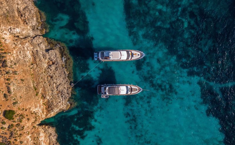 Aerial view of two boats sailing in Comino, Malta