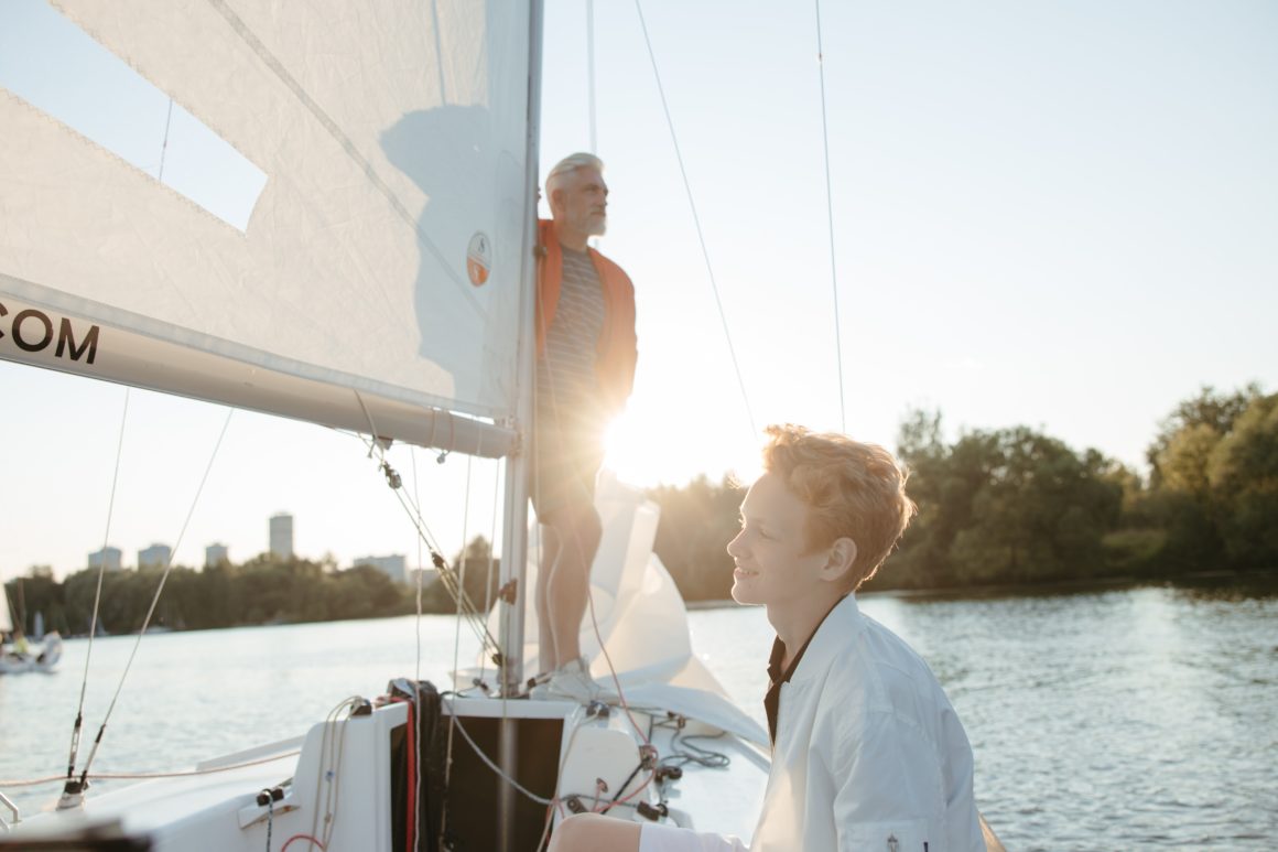 Grandfather and grandson sailing