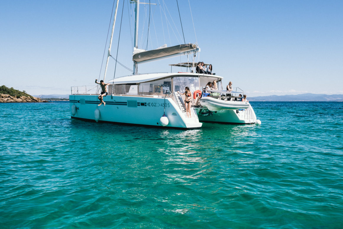 Catamaran, a luxurious type of boat, with two hulls, in blue turquoise sea