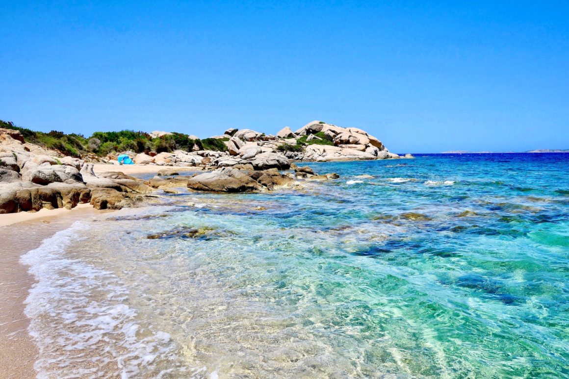 Crystal-clear water, granite rocks and white sand in Sardinia.