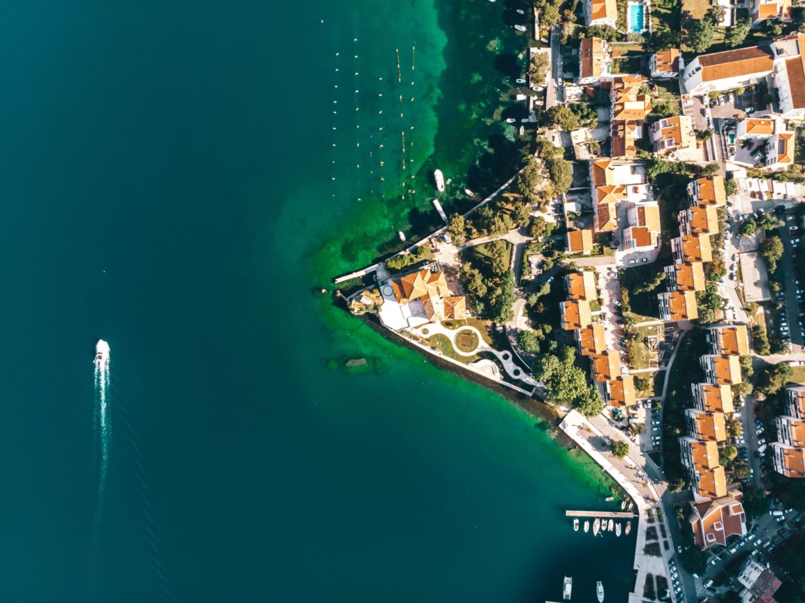 Aerial image of a boat sailing on a Montenegro holiday