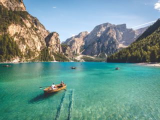 row boats on an alpine lake in Italy