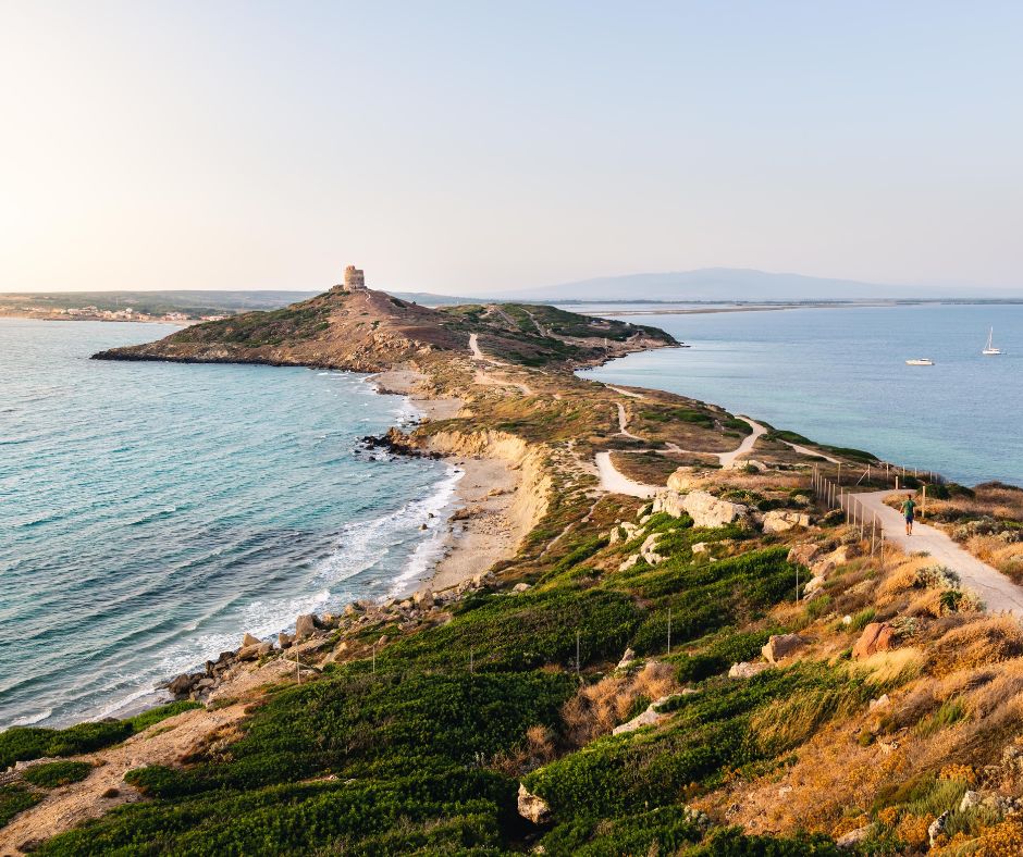 Things to do in Sardinia, Lighthouse at the end of a Peninsula in Sardinia, Italy
