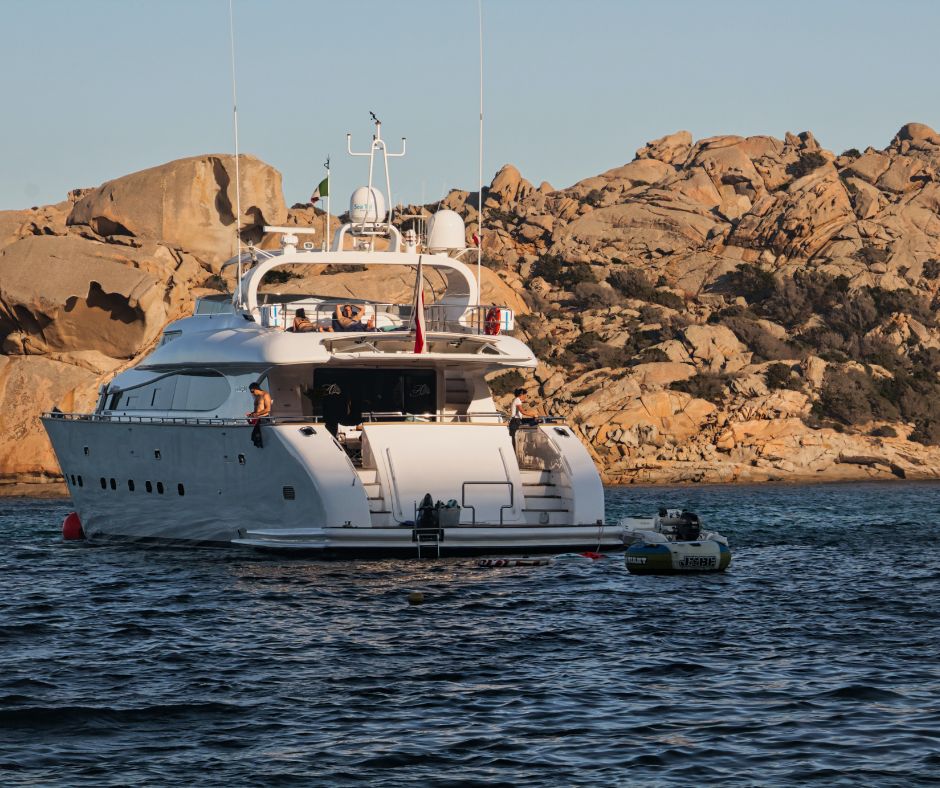 Things to do in Sardinia, Motor yacht in Sardinia at Sunset
