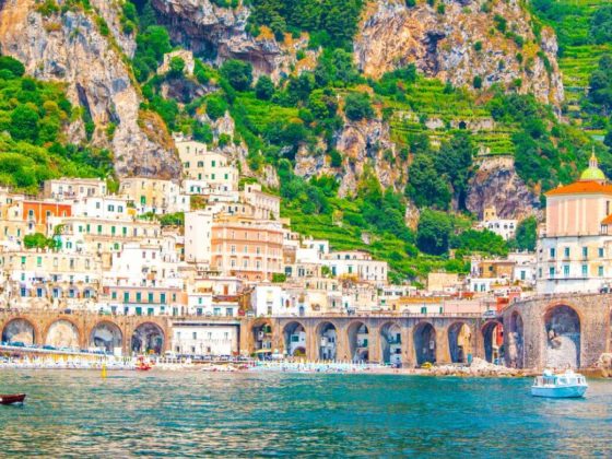 Beautiful picture of an Italian city on a green and rocky cliff