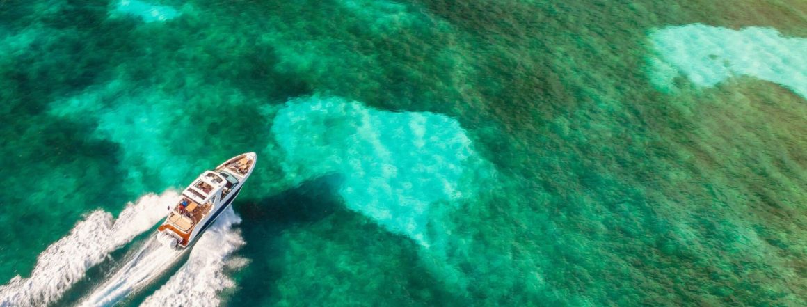 Motorboat cruising on transparent water