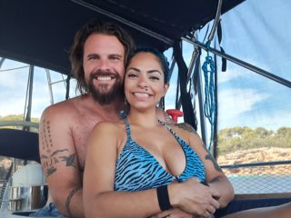 Picture of Andrew and his wife, Hiba, on their sailboat