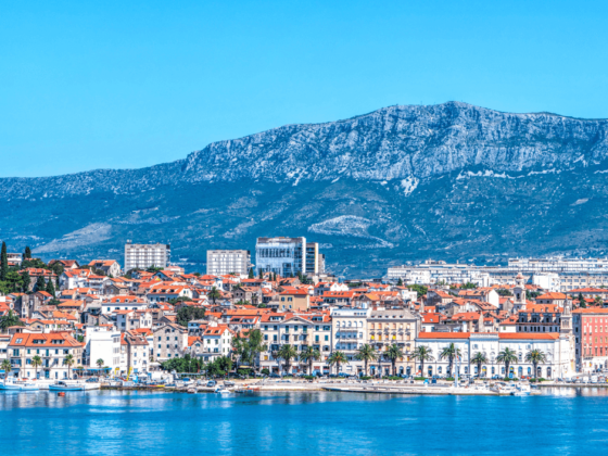 Panoramic view of Split waterfront and mountains.