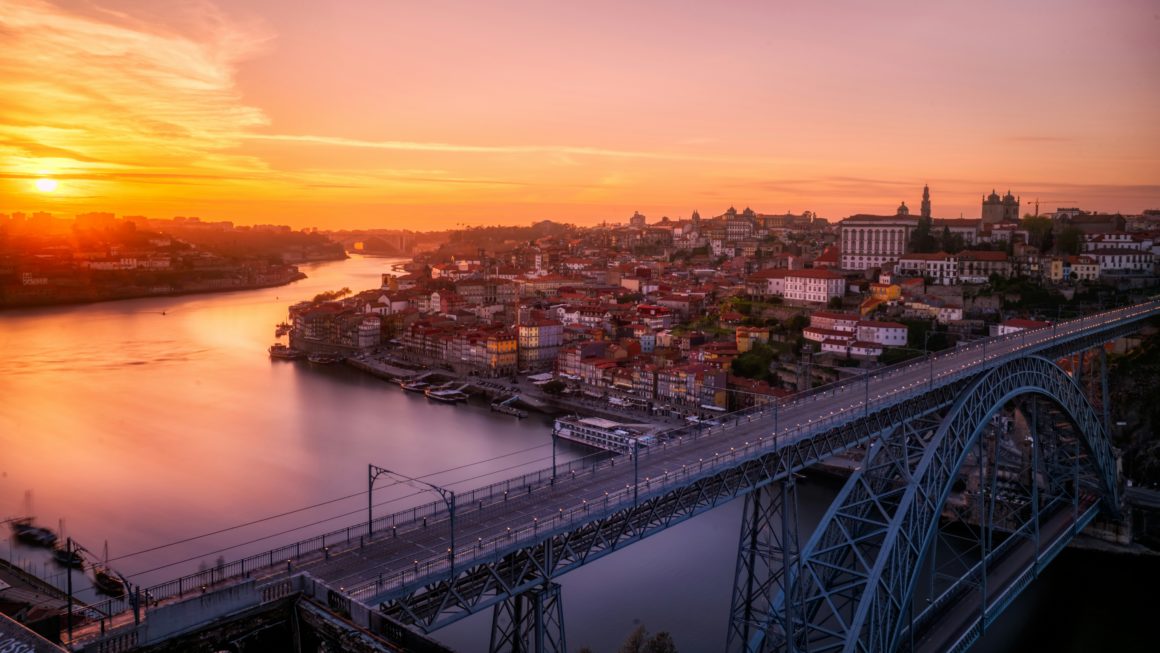 Sunset view of the Douro River and Dom Luís I Bridge in Porto.