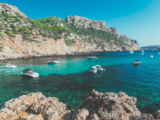 Boats in turquoise water in the Balearic Islands