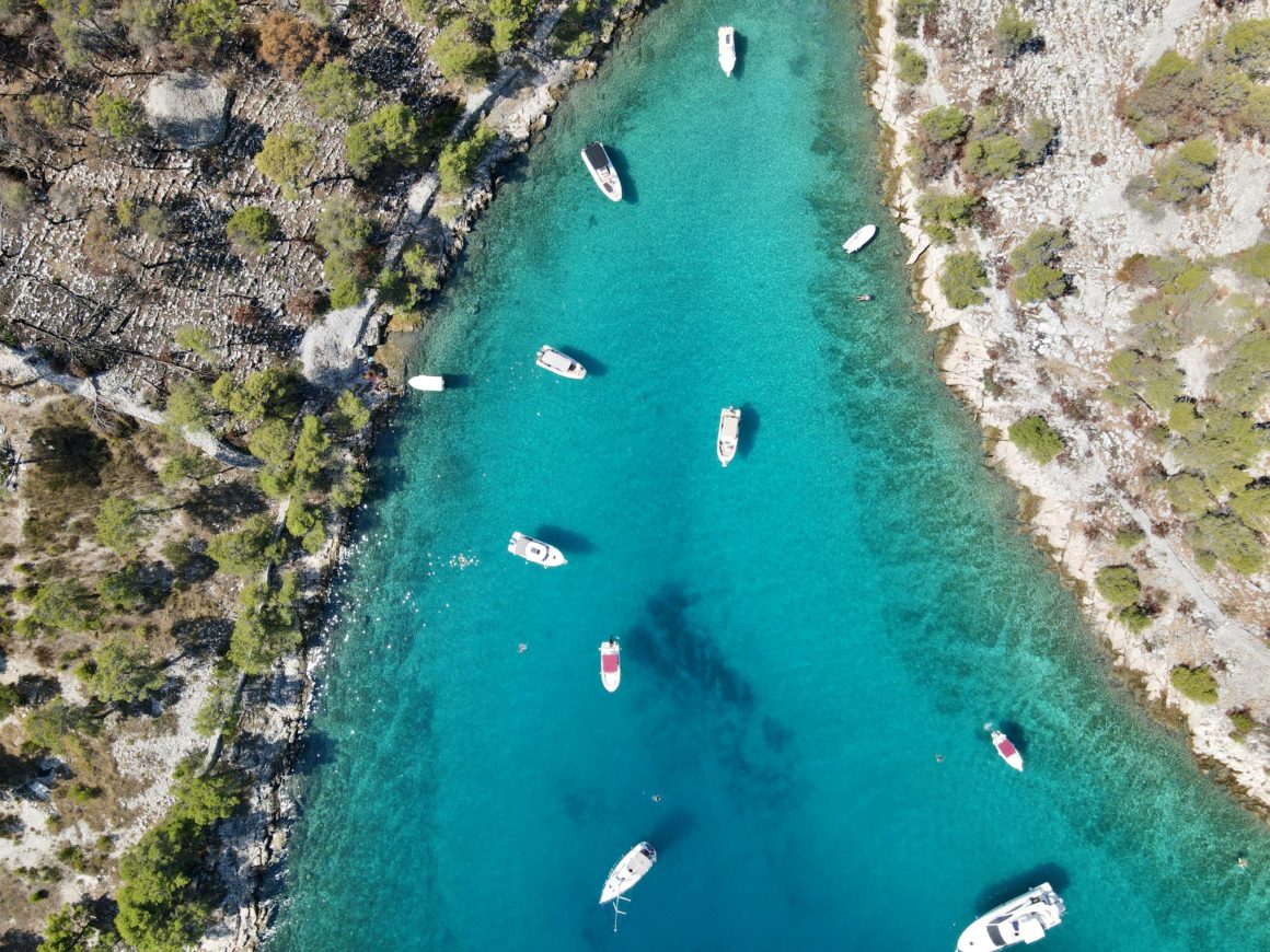 Aerial view of boats anchored in a turquoise bay near Milna.