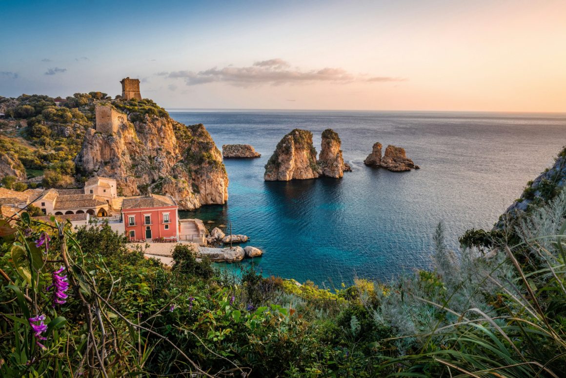 Historic tower and sea stacks of Scopello in Sicily.
