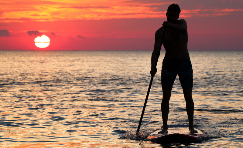 This image has an empty alt attribute; its file name is paddleboarding-1.png