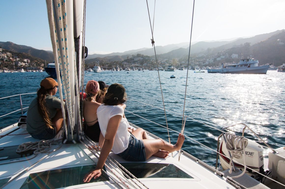 People on a sailboat arriving at Santa Catalina Island