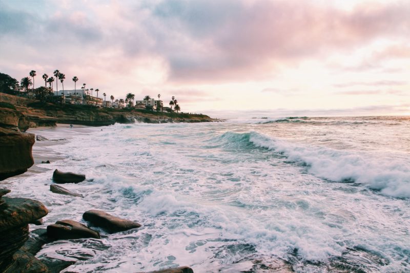 Waves crashing on a beach in San Diego, CA