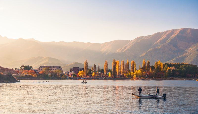 Lake tahoe boat rentals and fishing charters with mountain landscape in the background 