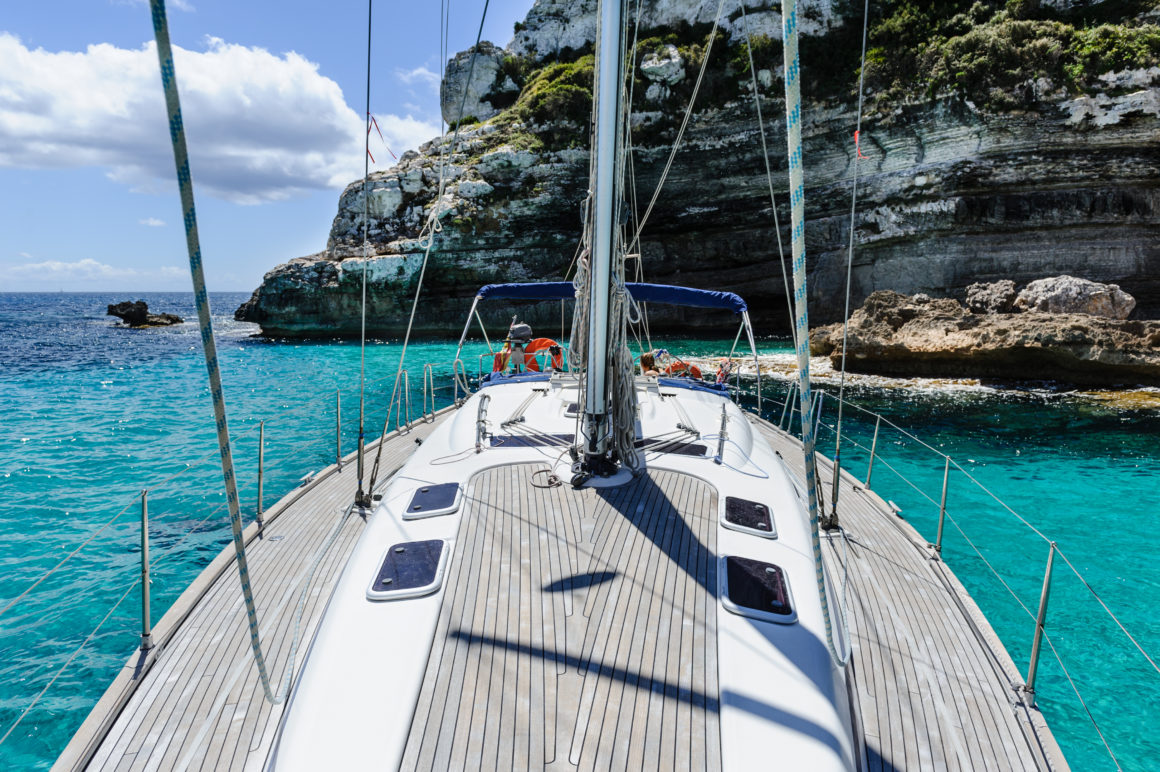 Boat deck out on the water with ropes