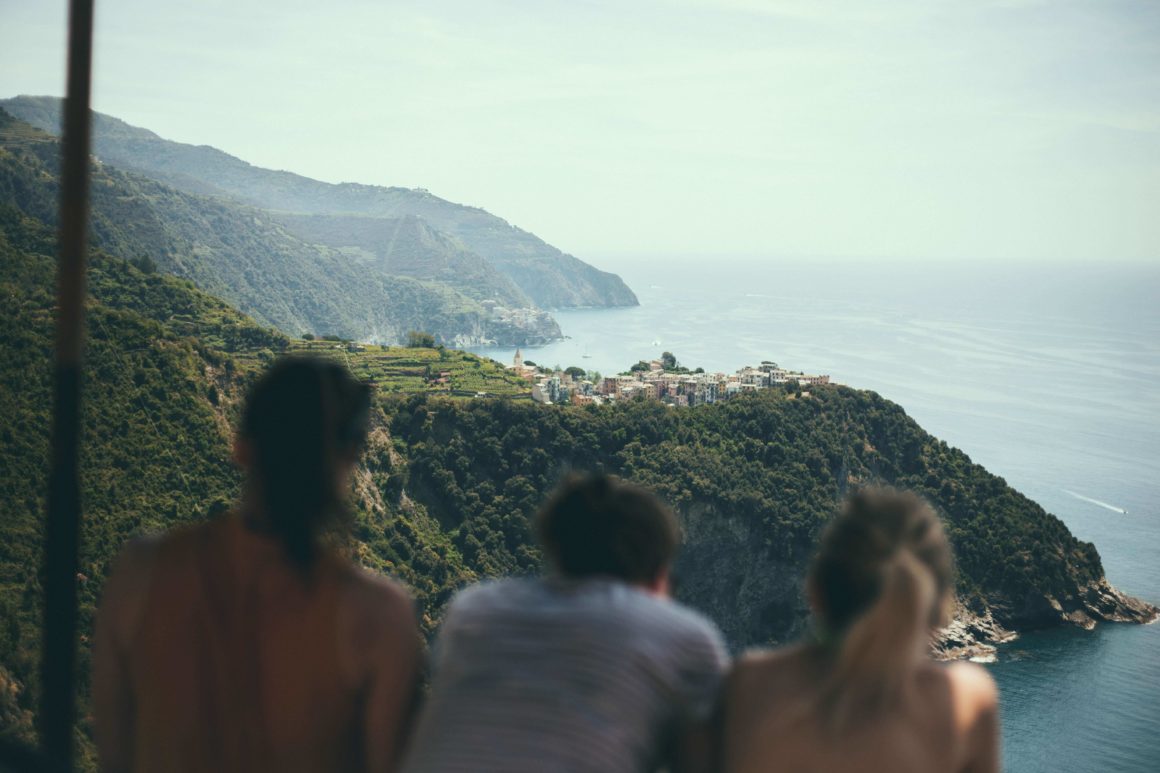 Three people looking at the view from Corniglia, Italy