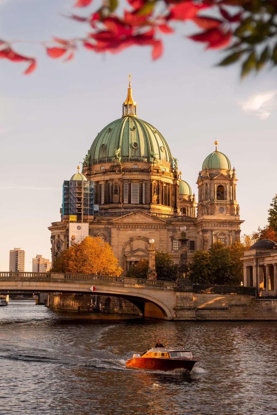 A boat on the Spree River in front of the Berlin Cathedral