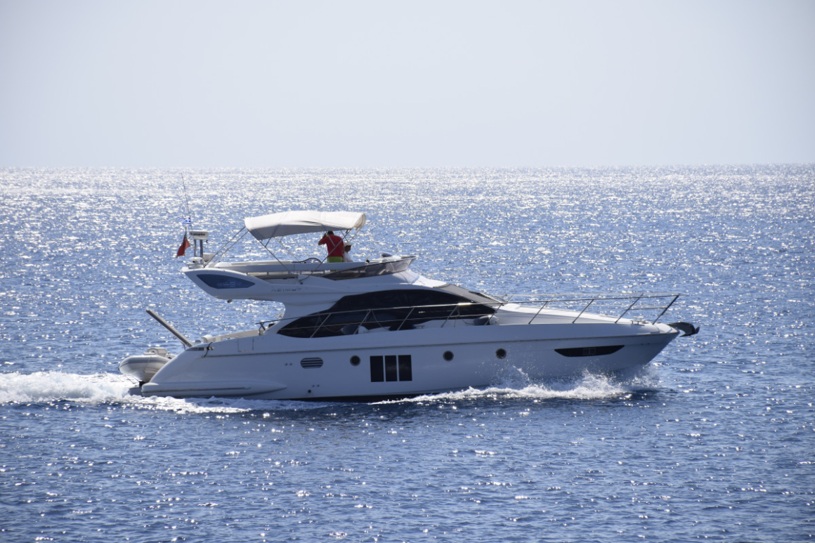 Photo of yacht cruising in the water 