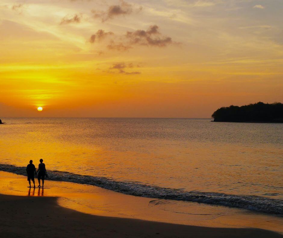 two people enjoying the sunset in the Carribean
